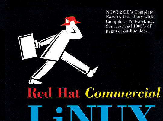 Red Hat Commercial Linux CD のケースに記載された「ランニングマン」のロゴ。