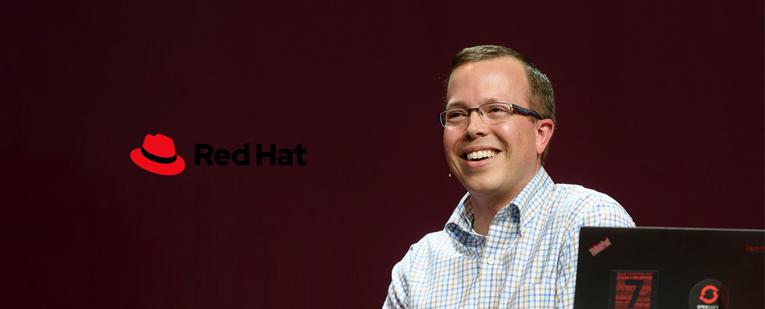 Image showing misuse: Red Hat logo on an image with low contrast.