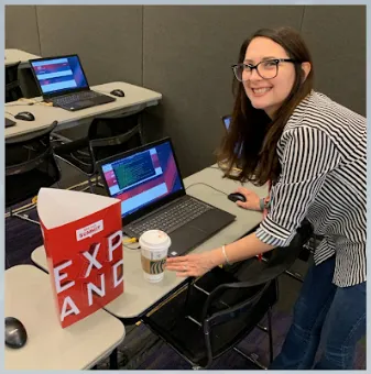 A photograph of Noe working a Red Hat Summit 2019