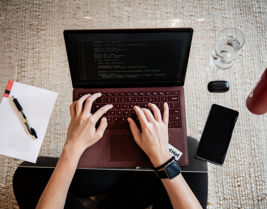 Image of a figure working on their computer